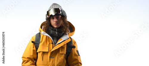 Snowboarder young man wearing snowboarding gear on white background. Banner with copy space. © Lara