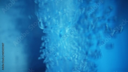 Oxygen stream. Bubbling liquid. Glass sparkling pure mineralized fizzy water gas