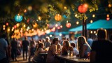 A bustling street fair filled with pedestrians under the glow of overhead party lights. Shallow depth of field, bokeh and intentional blur.