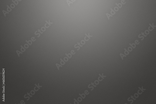 Light gray and grey textured paper background with light effect. High resolution full frame background with copy space in black and white.