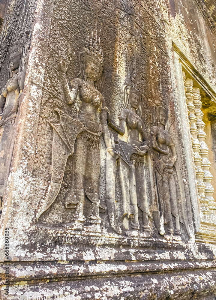 The famous bas-relief of Apsaras, celestial maidens, with intricate hairstyles on the inside wall of the first floor of the Angkor Wat temple in Siem Reap, Cambodia.