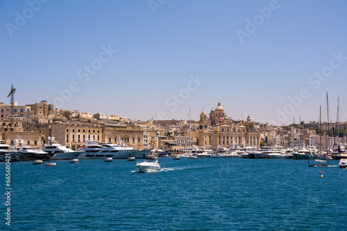 Vittoriosa harbor with yachts and boats and the dome of the cathedral in the background © Angelo D'Amico