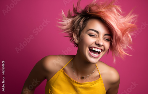 Portrait of a happy young woman with pink hair on a pink background