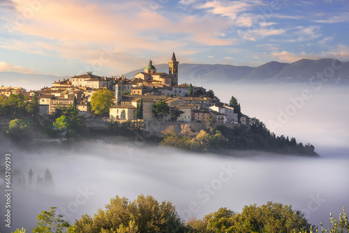 Trevi picturesque village in a foggy morning. Perugia, Umbria, Italy.