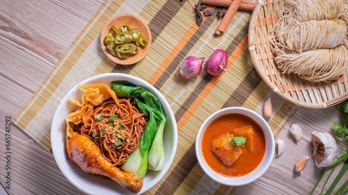 Closeup of a plate of noodle soup with meat