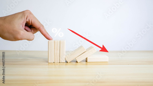 Interest rate and mortgage concepts Wooden block with percentage icon symbol and arrow pointing up The economy is getting rather worse.