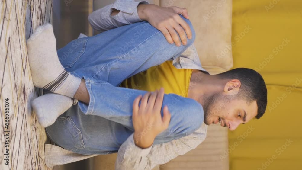 Vertical video of Cowardly man hiding and looking around. Vertical video of Cowardly man hiding and looking around.