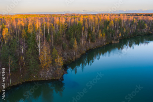 Autumn nature in Estonia, forest on the shore of a lake. photo