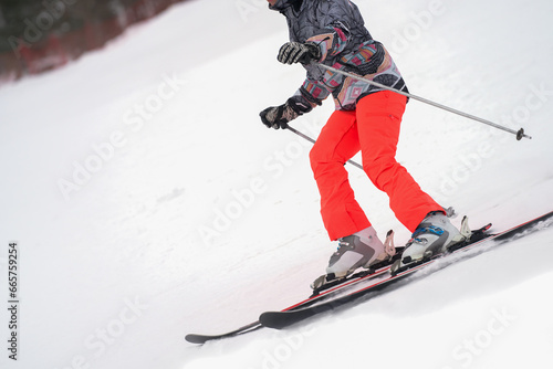 Alpine skier close-up on the ski slope.