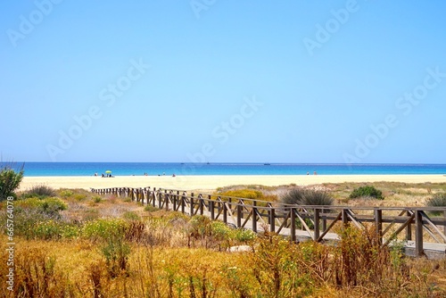 wooden walkway to access the beach through the dunes on the wonderful beach of Tarifa  Costa de la Luz  Andalusia  C  diz  Spain