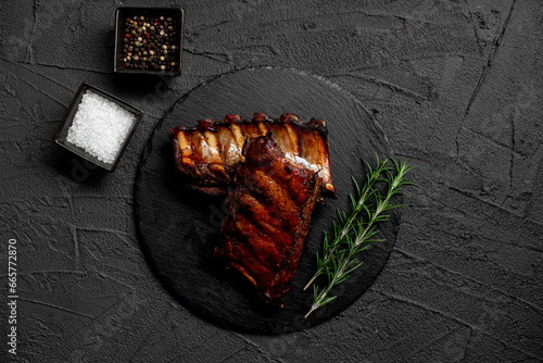 grilled pork ribs on stone background