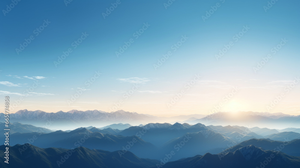 A mountain range, with peaks of various heights and shapes, looms on the horizon The sky is a brilliant, clear blue, and the sun is setting in the distance