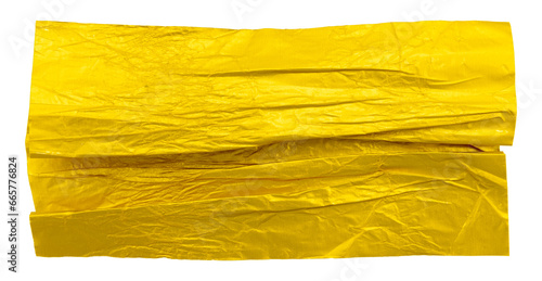 A piece of crumpled yellow foil on a white background. Foil