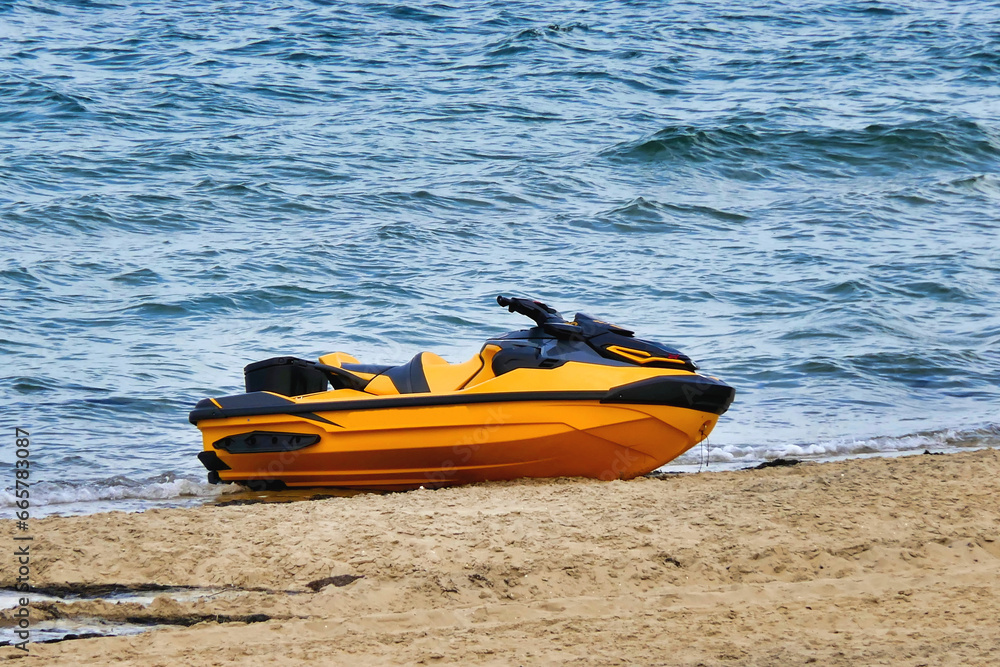 A Jet Ski, or Sea Scooter, left abandoned on the shoreline at Arcachon, France
