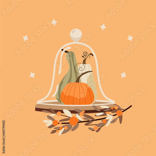 Cute Pumpkins and branch with leaves in glass cloche jar. Cozy fall Thanksgiving Halloween home decor objects isolated on orange background. Autumn vegetables hygge mood