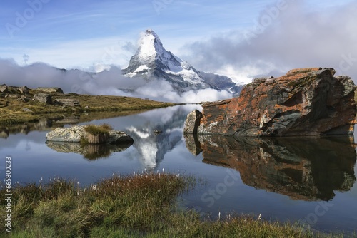 The Stellisee lake with a reflection of Matterhorn during a lovely morning hike in Zermatt, Switzerland