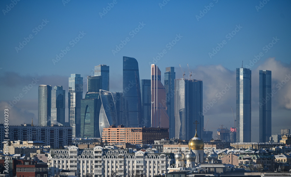 January 7, 2023, Moscow, Russia. Clouds over the Moscow City office center building on a winter day