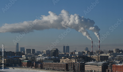 January 7, 2023, Moscow, Russia. Steam from the pipes of a thermal power plant over the Russian capital on a frosty winter day.