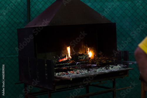 Fire starting in barbeque at summer evening