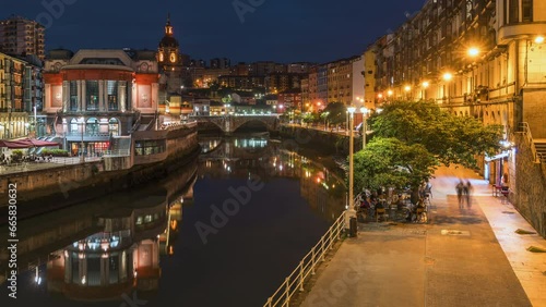 Dusk to night timelapse view of the medieval Casco Viejo neighbourhood of Bilbao, Basque Country, Spain. photo