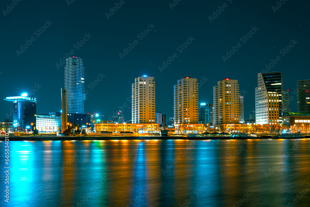 Spectacular Night View of Rotterdam from the Sea: Experience the Beauty of the City at Night.