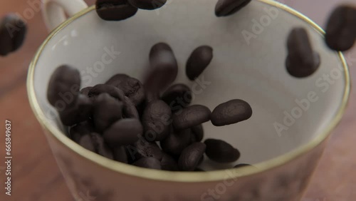 Close up of Coffee beans falling into a cup in slow motion