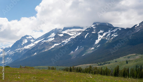 rocky mountains with snow covered in summer