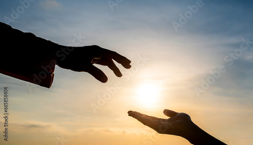 silhouette of god s giving a helping hand hope and support each other over sunset background