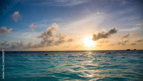 colorful sunset over ocean on maldives © Enzo