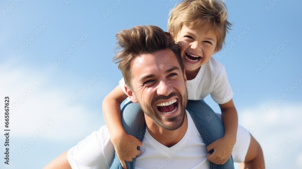 Father's day. Dad and son playing against blue summer sky background. Father's day. Dad and son playing against blue summer sky background.