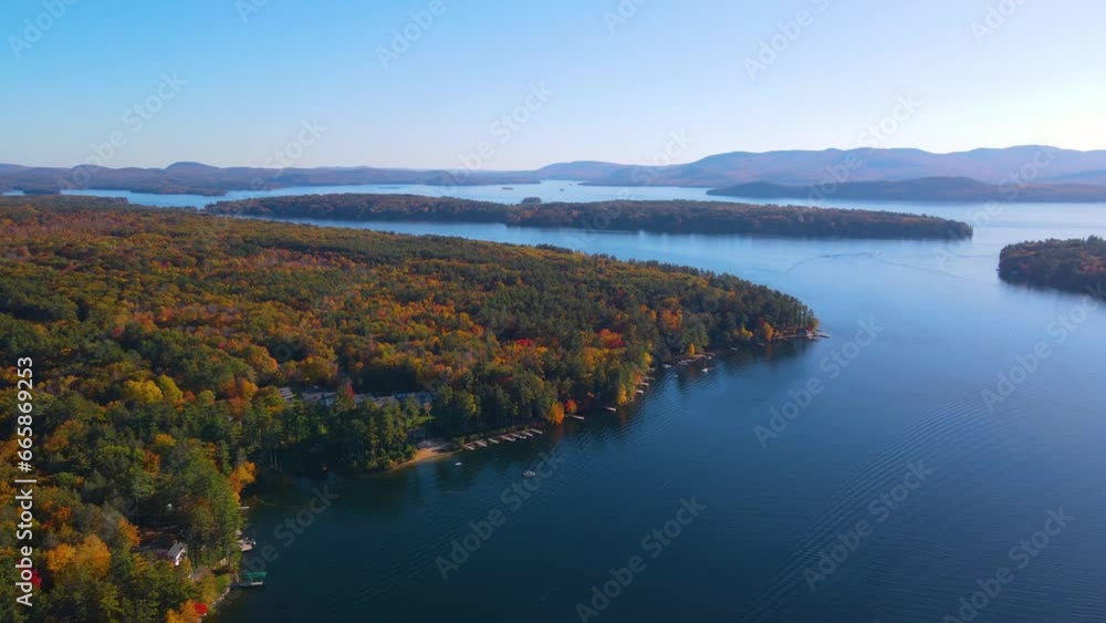 Mirror Lake shore at Lake Winnipesaukee aerial view in fall in town of Wolfeboro, New Hampshire NH, USA. Mirror Lake shore at Lake Winnipesaukee aerial view in fall in town of Wolfeboro, New Hampshire NH, USA.