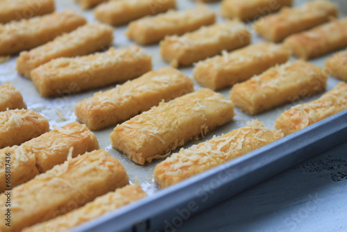 Rows of Indonesian cakes called kastangel on a table ready to serve photo