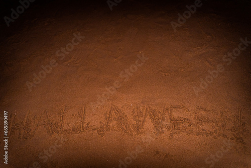 Halloween background on sandy beach near ocean in Patong, Phuket, Thailand with footprints, demons, ghosts.