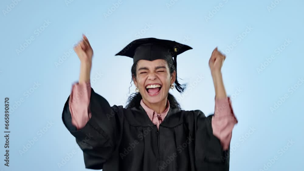Graduation success, celebration or happy student in studio with education, college or university goal. Smile, win or proud graduate excited by learning achievement or scholarship on blue background Graduation success, celebration or happy student in studio with education, college or university goal. Smile, win or proud graduate excited by learning achievement or scholarship on blue background