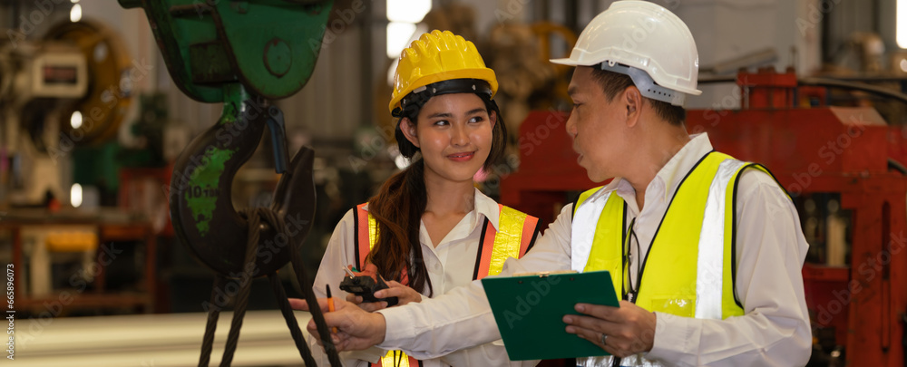 Machine Foreman Factory foreman worker and engineer conduct inspection of steel machine ...