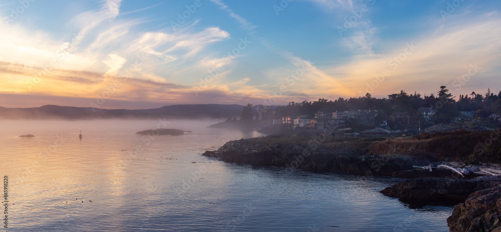 Rocky Shore on the Pacific Ocean Coast. Foggy Sunset. Victoria, Vancouver Island, BC, Canada.