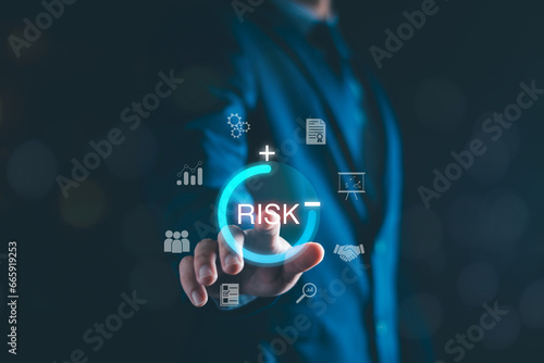 Risk manage, Business risk assessment. Businessman assess investment, Safety control risk. Reduce opportunity for financial investment, projects, manage business. Manage low level strategy. photo