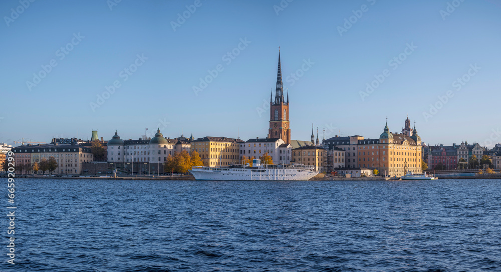 The islands Riddarholmen and the old town Gamla Stan, hostel ship and churches, a sunny colorful autumn day in Stockholm