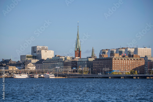 Down town with offices, church and steam boat harbor, a sunny colorful autumn day in Stockholm