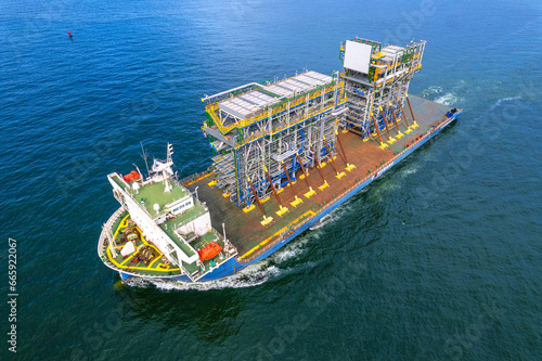 large cargo ship Transporting loads of oil rig parts