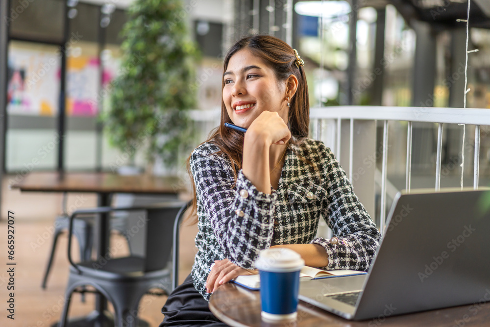 Portrait of smiling happy beautiful woman relax using technology of laptop computer sitting on chair.Young hipster creative girl freelancer business thinking with new idea content in cafe Portrait of smiling happy beautiful woman relax using technology of laptop computer sitting on chair.Young hipster creative girl freelancer business thinking with new idea content in cafe