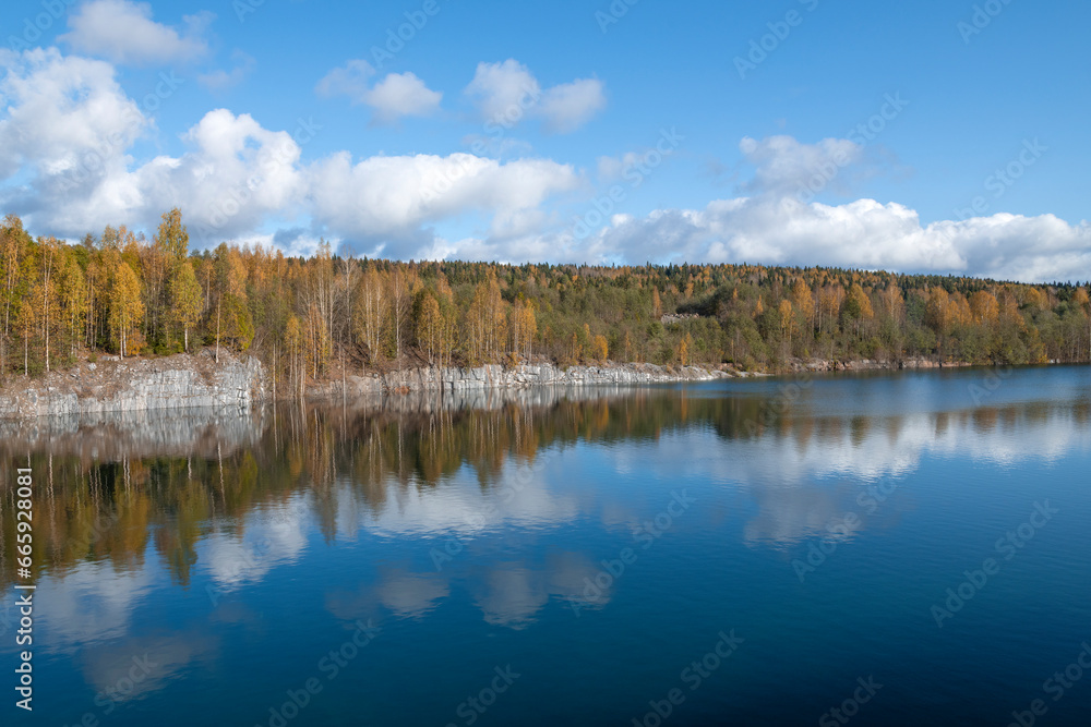 Golden autumn on an old flooded marble quarry. Karelia, Russia