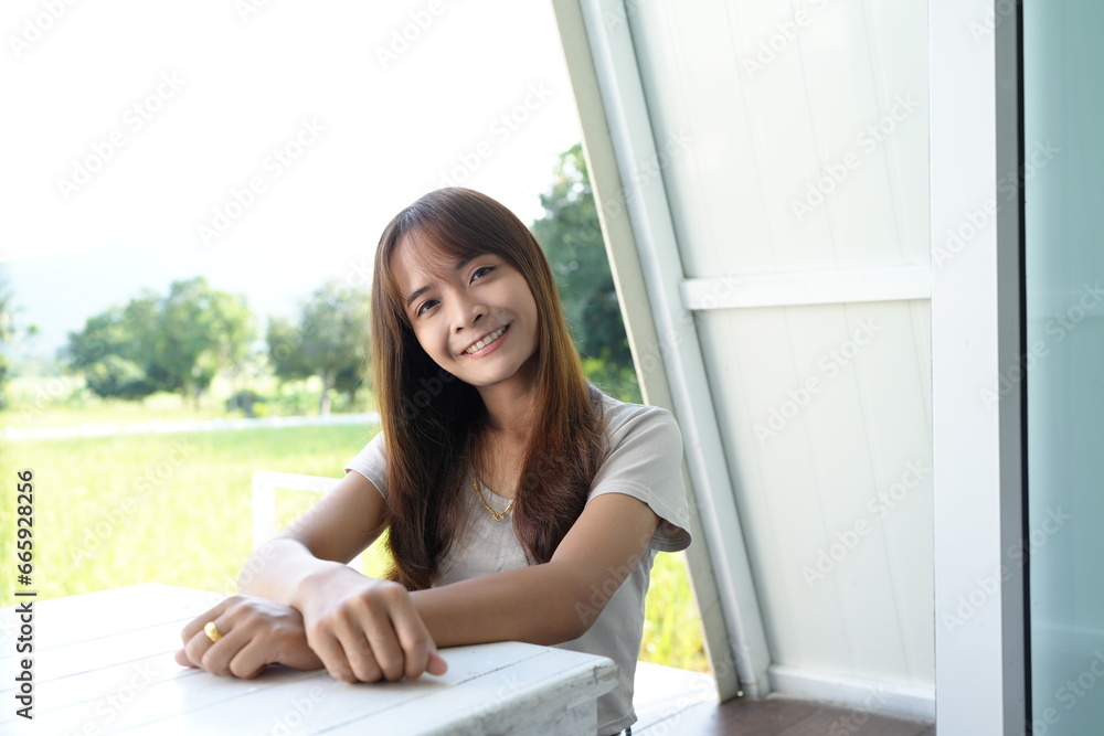 happy female tourist Sit and admire the view on your balcony.