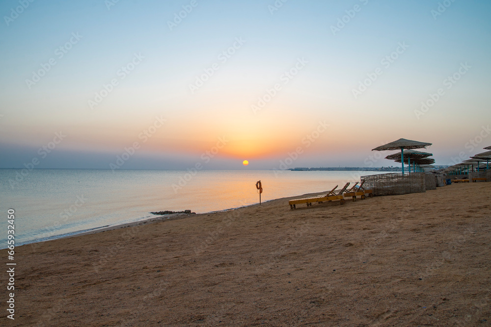 Landscape of sunrise, sun, sky and beach on the shores of the Red Sea