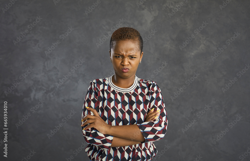 Portrait of displeased grumpy mad young black woman pouting lips and ...