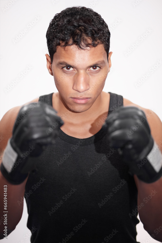 Portrait, fight and a man or boxer on a white background for a competition, fitness or training for a match. Exercise, cardio and a strong male fighter with gloves for a sport, boxing or workout
