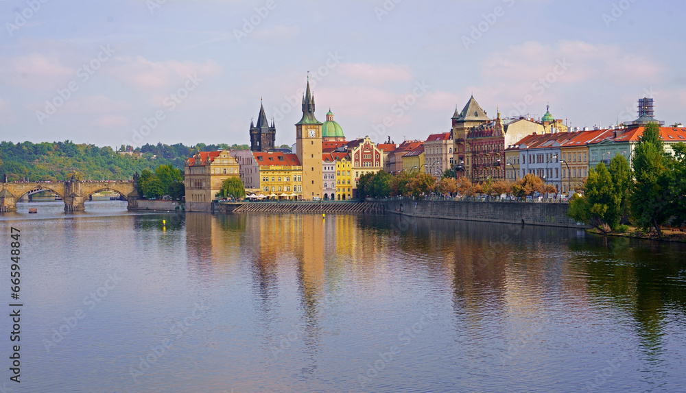 Prague - Charles bridge, Czech Republic. September 2023. Scenic aerial sunset on the architecture of the Old Town Pier and Charles Bridge over the Vltava River in Prague, Czech Republic.
