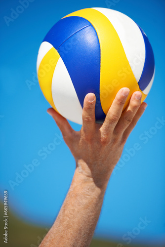 Beach, hands and sports person with volley ball for outdoor game, competition or tournament challenge. Summer wellness, blue sky and closeup volleyball player for fitness, exercise or active workout