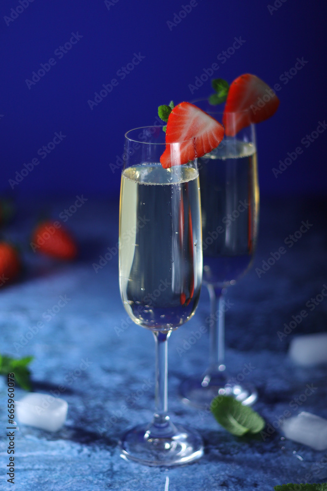 Two glasses of champagne with strawberry Two glasses of champagne with strawberry