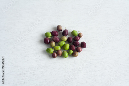 Fresh Olives, Green and Purple Fruits, isolated on white background